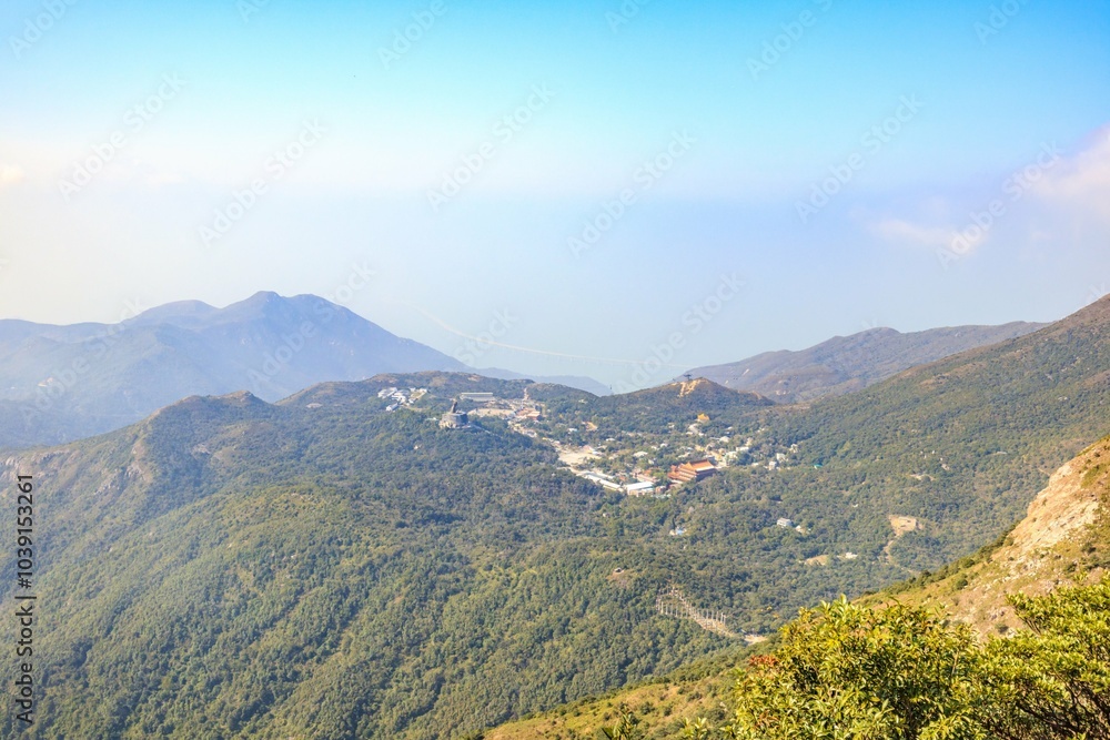 Fototapeta premium Scenic Mountain Village Surrounded by Lush Greenery