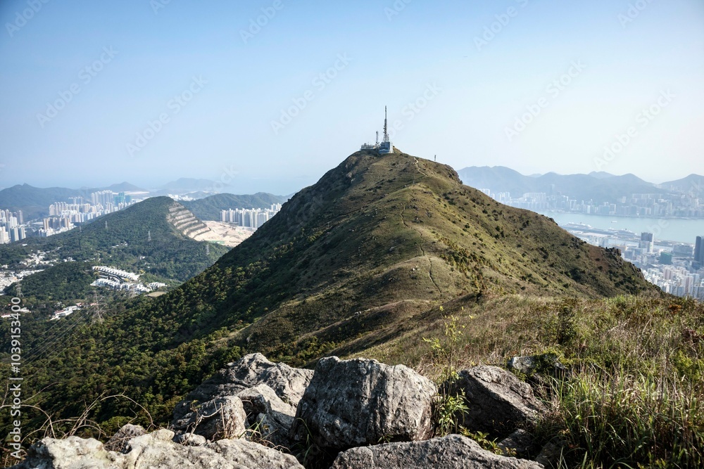 Fototapeta premium Scenic Pathway Overlooking Urban Cityscape and Harbor, Hong Kong