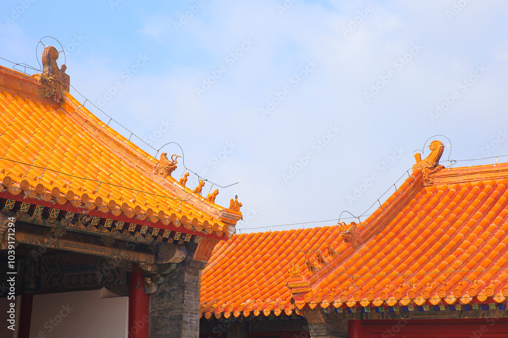 The blue glazed tiles on the wall as the background, the traditional architecture The blue glazed tiles on the wall as the background, the traditional architecture