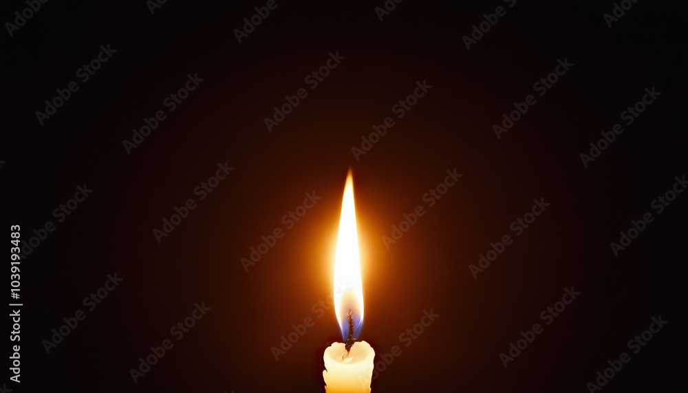Fototapeta premium A candle is lit in the dark with a candle nearby 5