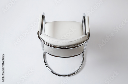 a cantilever chair with a chrome frame and leather seat photo