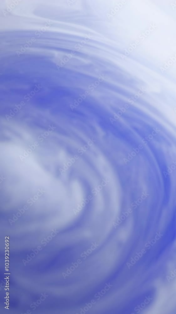 Vertical video. Color smoke. Acrylic water mix. Blue pastel steam cloud flowing swirl dynamic air haze silk paint fluid ink abstract art background. Vertical video. Color smoke. Acrylic water mix. Blue pastel steam cloud flowing swirl dynamic air haze silk paint fluid ink abstract art background.
