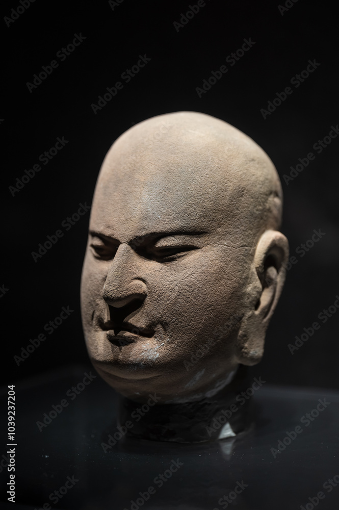 Close-up of the head of a Buddhist stone statue Close-up of the head of a Buddhist stone statue