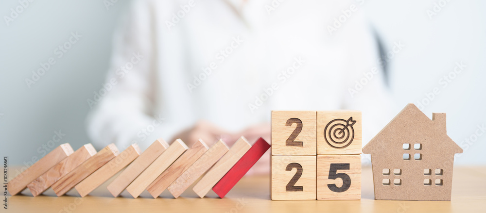 2025 year with wood block falling to Home model and business icon. Real estate Mortgage, Refinance, House loan and debt, Interest rate, Insurance, Financial Property and economic recession 2025 year with wood block falling to Home model and business icon. Real estate Mortgage, Refinance, House loan and debt, Interest rate, Insurance, Financial Property and economic recession