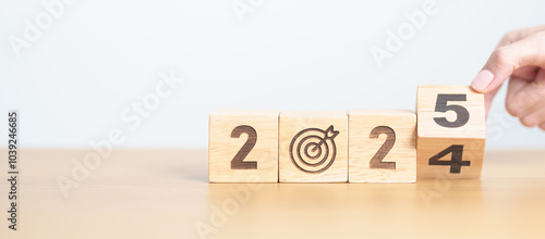 2024 year change to 2025 year block with dartboard icon. Goal, Target, Resolution, strategy, plan, Action, mission, motivation, and New Year start concepts photo