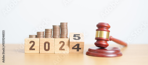 Wallpaper Mural 2024 end year to Happy New Year 2025 with judge gavel and money coins stack on desk. Law cost, lawyer, judgment, justice auction and bidding concepts Torontodigital.ca