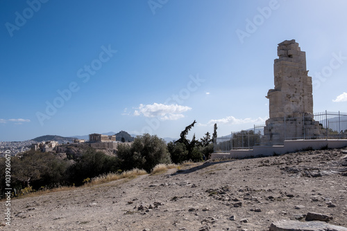 View of the Philopappos Monument, an ancient Greek mausoleum and monument dedicated to Philopappus, located on Mouseion Hill in Athens, Greece, southwest of the Acropolis. photo