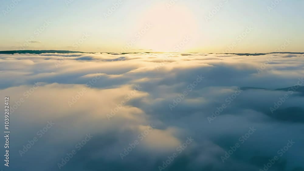 Bright sunrise above the clouds with soft morning light Bright sunrise above the clouds with soft morning light