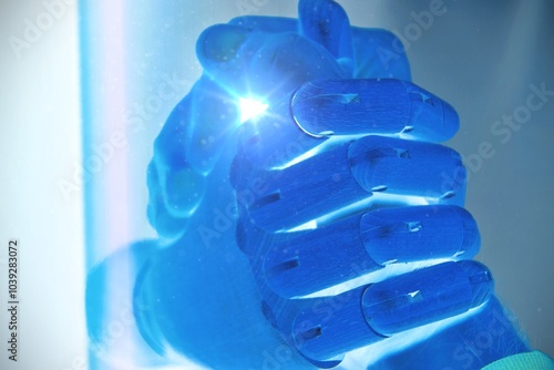 Fotografie Conceptual photo representing competition Human and robot arm wrestling