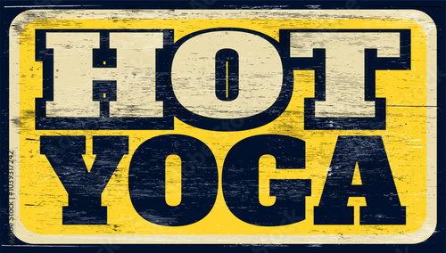 Aged and worn hot yoga sign on wood