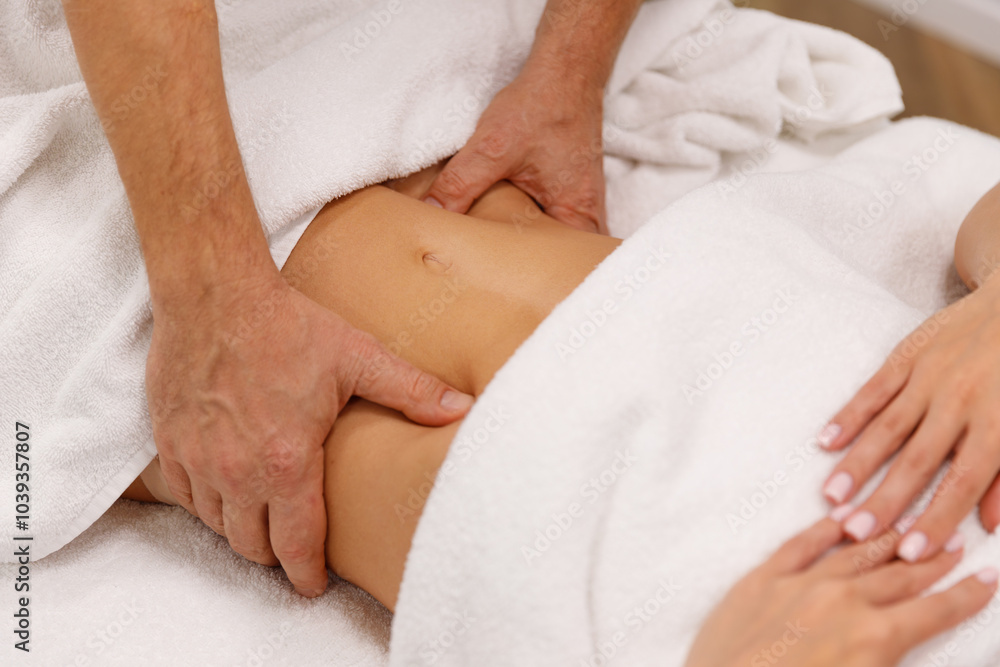 A relaxing abdominal massage performed by a woman’s hands, promoting wellness and relaxation. Ideal for themes of spa treatments, body care, and therapeutic massage A relaxing abdominal massage performed by a woman’s hands, promoting wellness and relaxation. Ideal for themes of spa treatments, body care, and therapeutic massage