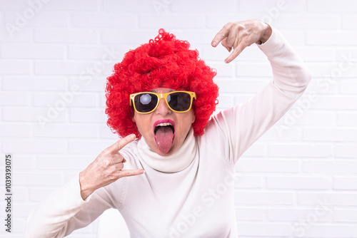 woman in costume with wig making rebellious gesture photo