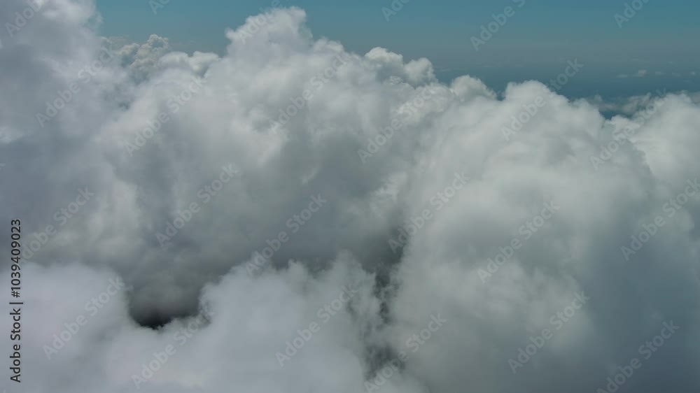 Flying through beautiful white fluffy clouds in blue sky. Airplane travel background, 4k Flying through beautiful white fluffy clouds in blue sky. Airplane travel background, 4k
