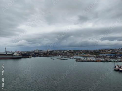Port Elizabeth South Africa apr 6 2024 Cloudy Day Over Bustling Harbor and Docked Boats