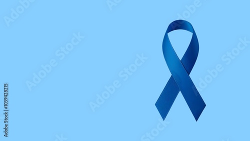 Blue ribbon on blue background with copy space. World Diabetes Awareness Month November and Prostate Cancer Awareness. Health care, medical awareness, illness prevention.