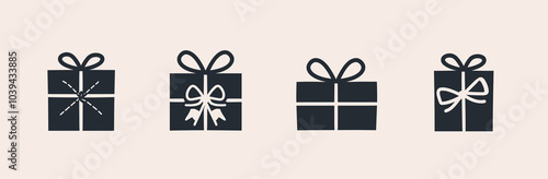 Four stylishly wrapped gift boxes in minimalist black and white design, showcasing diverse bow and ribbon styles.