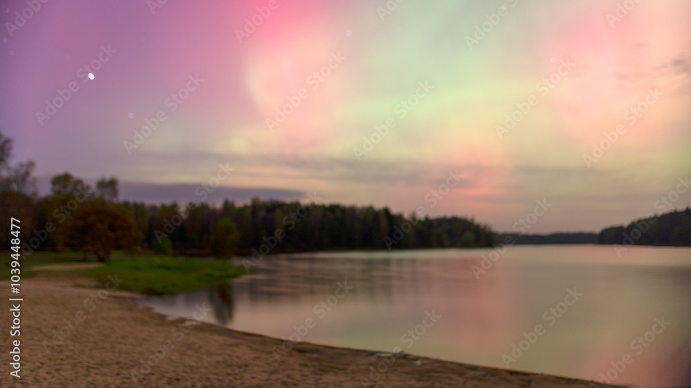 Fototapeta premium color photo with beautiful northern lights in the sky, northern lights over the lake