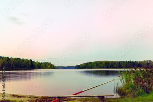 color photo with beautiful northern lights in the sky, northern lights over the lake photo