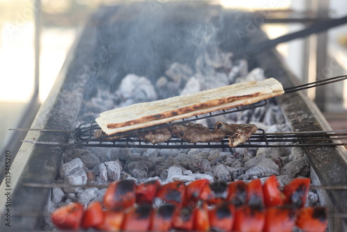 grilling adana kebap which is made from minced lamb meat