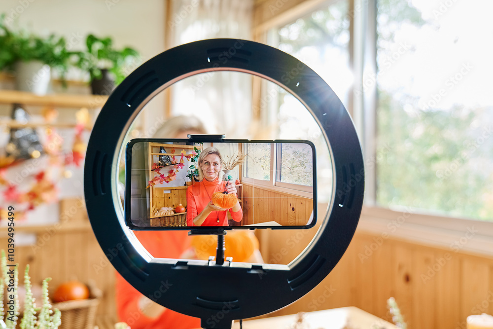 Mature woman seen on smart phone vlogging at home Mature woman seen on smart phone vlogging at home