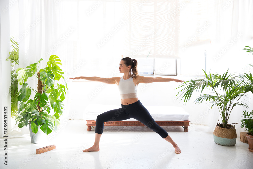Mid adult yoga instructor exercising at home Mid adult yoga instructor exercising at home