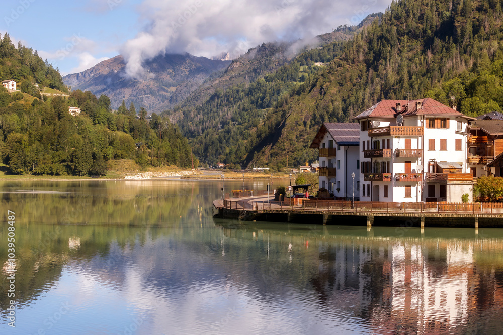 Fototapeta premium Alleghe, Italy houses and lake in Dolomites Alps