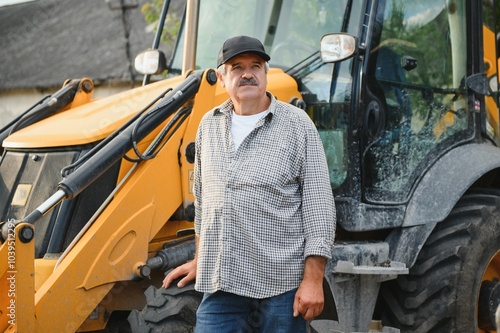 Construction driver with excavator on the background