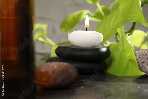 Spa composition with burning candle on grey table, closeup