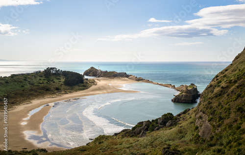 Obraz na płótnie The view from Deliverance Cove track. Castlepoint lighthouse in the distance. Wairarapa. New Zealand. w salonie