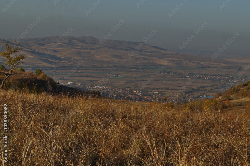 Fototapeta premium Amazing autumn view of glade, hill, forest with deciduous trees near to pretty village Zhrebichko, Bratsigovo municipality, Rhodope mountains, Bulgaria 