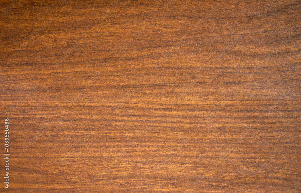Photo of the texture of a mahogany colored wooden background.Wooden background for the text. Photo of the texture of a mahogany colored wooden background.Wooden background for the text.