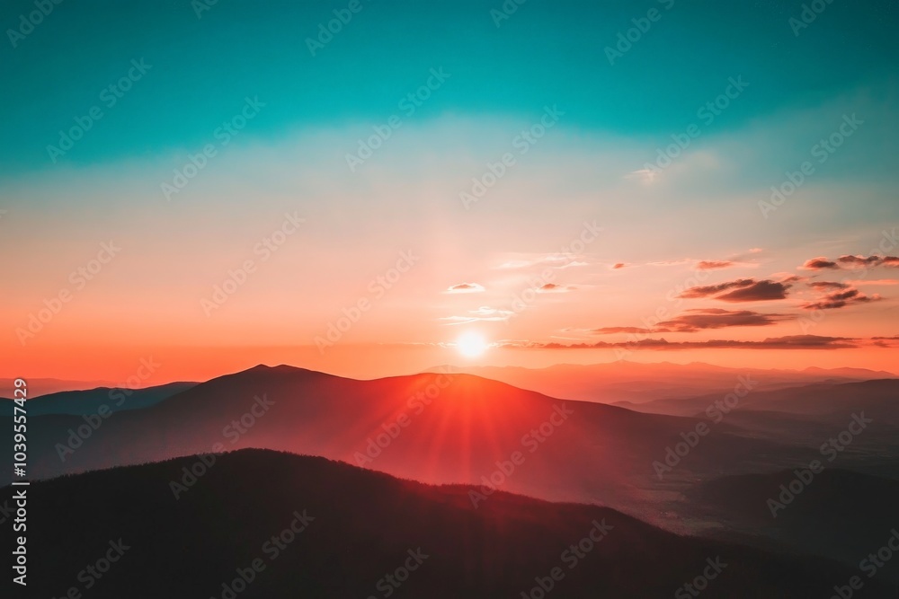 This image captures the setting sun over distant mountains, with long shadows cast across rolling hills. The sky is a vibrant blend of warm colors. This image captures the setting sun over distant mountains, with long shadows cast across rolling hills. The sky is a vibrant blend of warm colors.