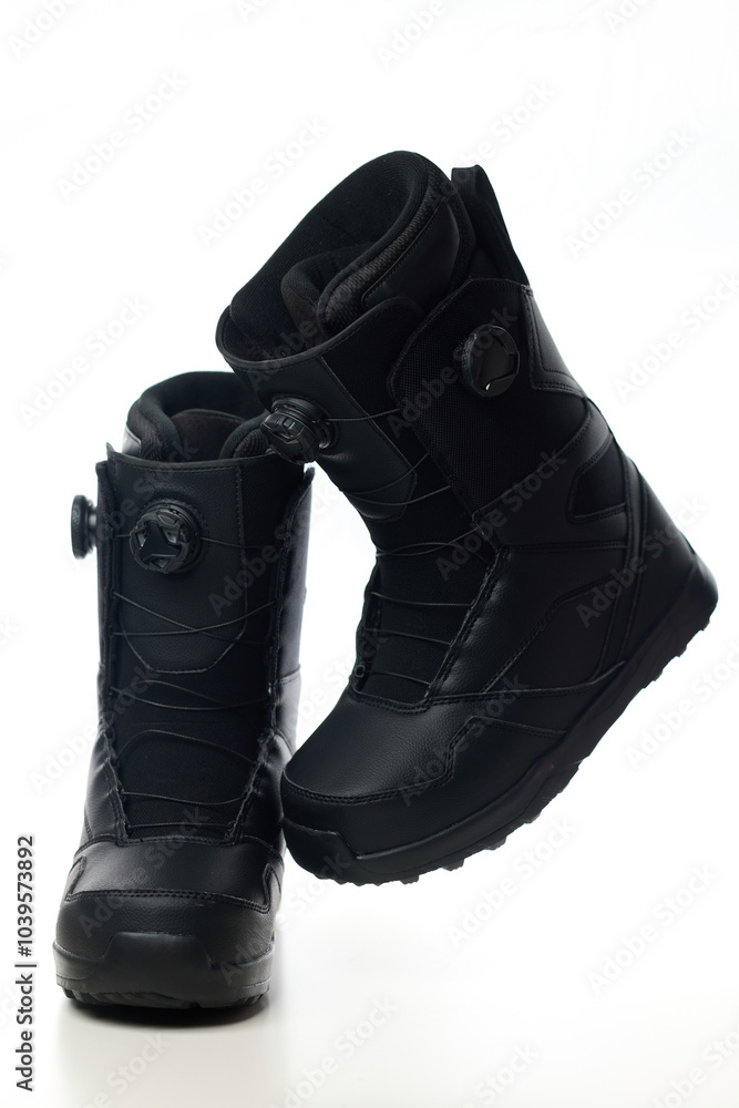 High-tech snowboard boots on an isolated white background. High-tech snowboard boots on an isolated white background.