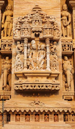 Carved sculpture of Lord Shiva with Parvati on Shri Trinetreshwar Mahadev Temple, Taranetar, Surendranagar, Gujarat, India. photo