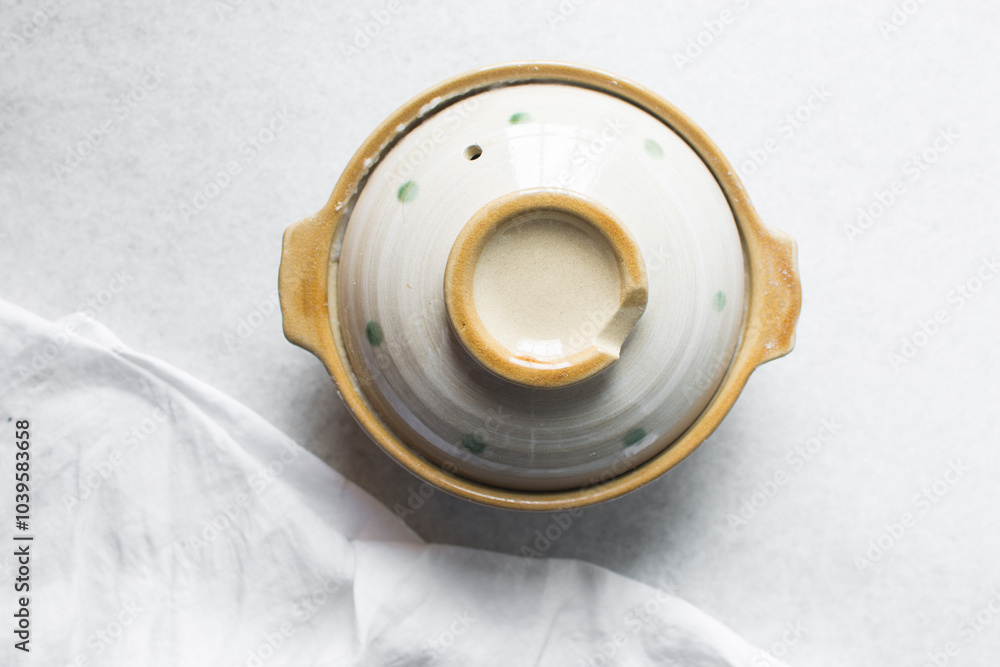Overhead view of japanese donabe on a marble countertop, top view of japanese countertop on a white background