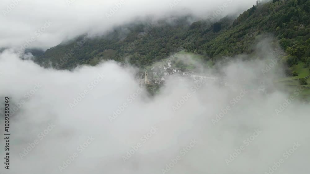 Drone video flying through the fog to unveal Soglio village in Upper Engadine, Grisons, Switzerland. Drone video flying through the fog to unveal Soglio village in Upper Engadine, Grisons, Switzerland.