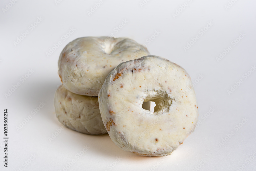 Several anise rings in the foreground and on a white background, a typical Christmas sweet. Several anise rings in the foreground and on a white background, a typical Christmas sweet.
