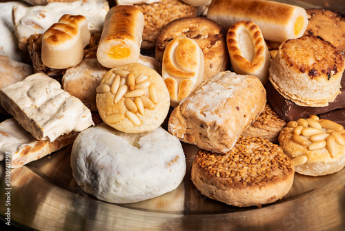 Tray full of mantecados, polvorones, roscos and other Christmas sweets, close-up. photo