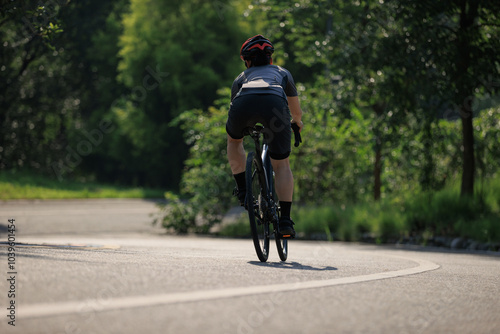 Wallpaper Mural Woman cyclist riding bike at summer park Torontodigital.ca