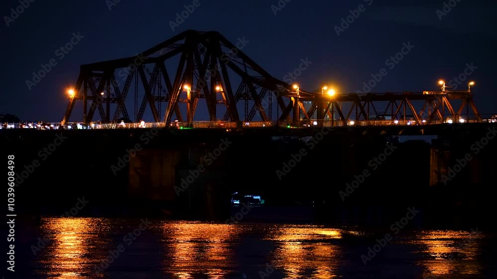 Beautiful sunset view of Long Bien bridge over Hong river (or Red river) that connects two districts, Hoan Kiem and Long Bien in Hanoi city, Vietnam. Beautiful sunset view of Long Bien bridge over Hong river (or Red river) that connects two districts, Hoan Kiem and Long Bien in Hanoi city, Vietnam.