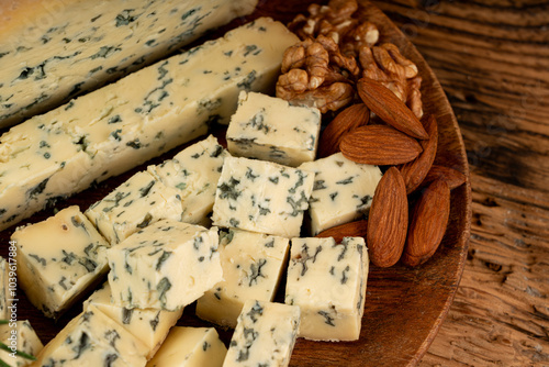 Fourme cheese, stinky french cheese, Fourme d'Ambert gourmet food, semi-hard blue cheese photo