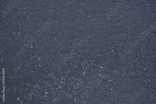 dark grey and light grey asphalt, junction of new and old road surfaces, repaired roadway