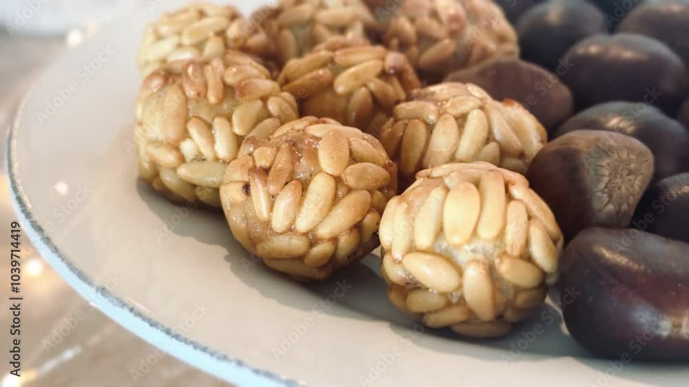 Typical Spanish pastries in Catalonia on All Saints' Day. Freshly baked Panallets on the tray. Typical Spanish pastries in Catalonia on All Saints' Day. Freshly baked Panallets on the tray.