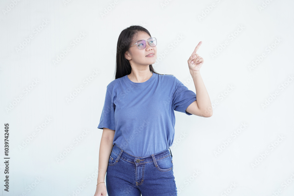 Beautiful Asian woman smiles while pointing to the side copy space, perfect for advertising or promotions on a white background Beautiful Asian woman smiles while pointing to the side copy space, perfect for advertising or promotions on a white background