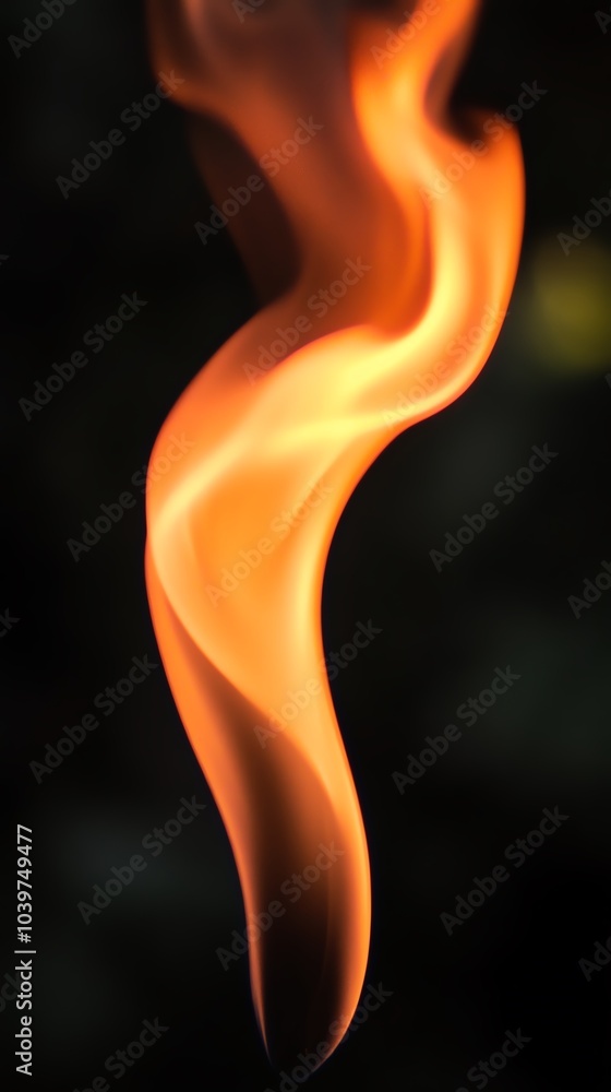 A mesmerizing swirl of orange flame dancing gracefully against a dark background, showcasing the beauty of fire's movement.