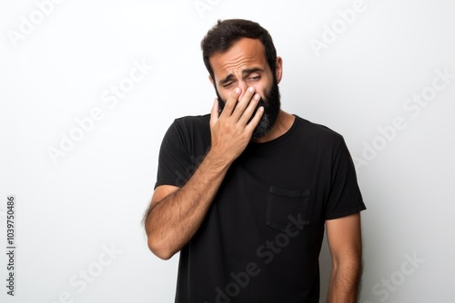 Hispanic man standing t-shirt finger.