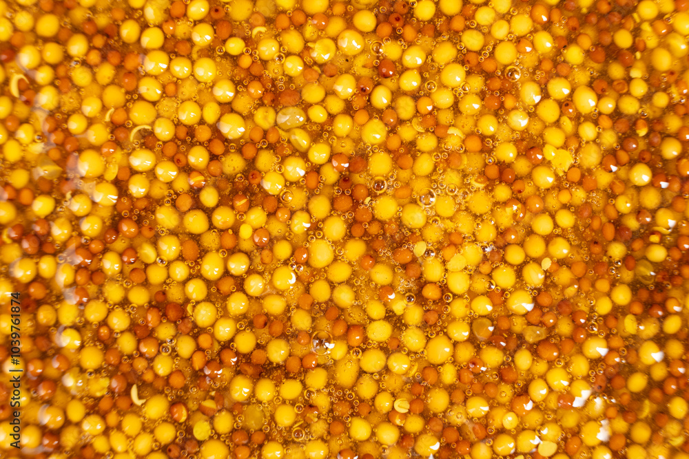 French Dijon mustard background, close-up, top view. French Dijon mustard background, close-up, top view.