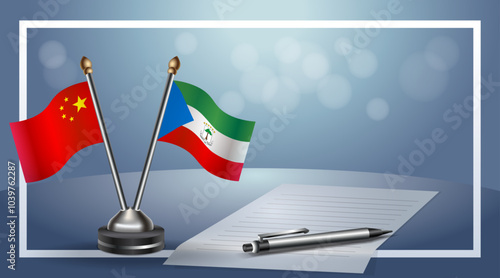 China and Equatorial Guinea Small national flag on bokeh background, cooperative relationship