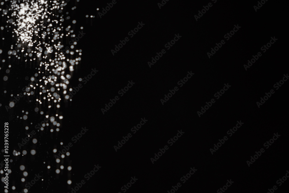 Abstract black and white background of pouring flour, space for text Abstract black and white background of pouring flour, space for text