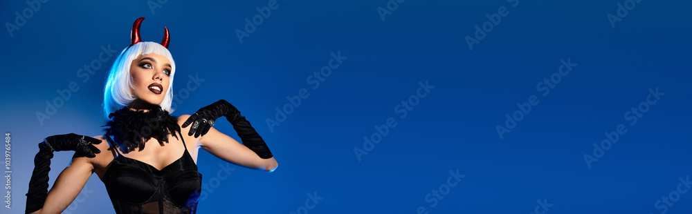 The young woman showcases her stunning Halloween costume with playful confidence and flair. The young woman showcases her stunning Halloween costume with playful confidence and flair.